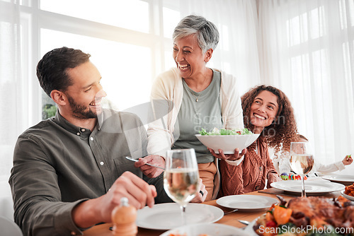 Image of Family, dinner and party, happy while eating together with love and food, celebration and holiday. Man with women at social gathering, relationship and hungry people with meal, happiness and carefree