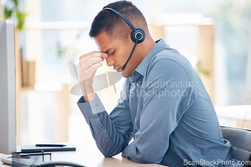 Image of Headache pain, tired or man in call center with burnout feeling overworked in crm communication. Migraine, office or stressed telemarketing sales agent with anxiety, fatigue or mental health problems