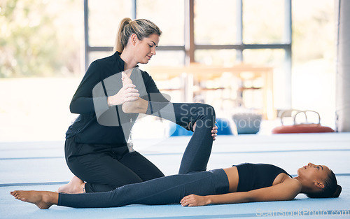 Image of Fitness, stretching and woman exercise with personal trainer at a gym for training, balance and wellness. Athlete female with coach for support and help with legs for gymnastics, aerobics or pilates