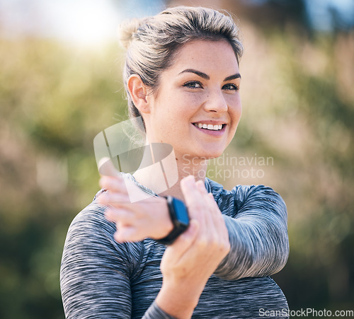 Image of Portrait, smile and fitness woman stretching arms for exercise, training and sports in park. Happy female athlete warm up for workout, performance and action in nature, garden and power for cardio