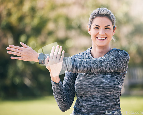Image of Portrait, happy woman and stretching arms for exercise, training and sports in park. Female athlete warm up for workout, performance and fitness outdoors in nature, garden and muscle power for cardio