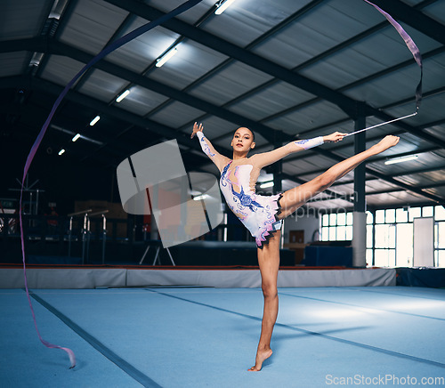 Image of Ribbon, gymnastics and portrait of woman balance in performance, dance training and sports competition. Female, rhythmic movement and flexible dancing athlete, action and creative talent in arena