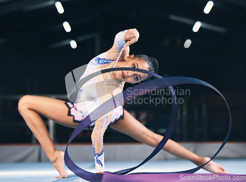 Image of Flexible woman, ribbon gymnastics and dancer in performance, sports competition and action show. Female, rhythmic movement and dancing athlete with creative talent, balance and moving with agility