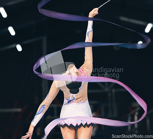 Image of Ribbon gymnastics, flexible woman and dancing in performance, training and competition from the back. Female dancer, rhythmic movement and elegant action of creative talent, sports and concert event