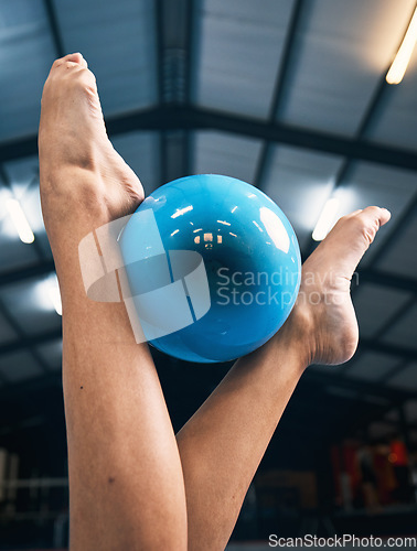 Image of Gymnastics, woman and feet with ball for competition, dance practice and sports training. Closeup of barefoot female gymnast, balance and equipment for agility, creative skill or performance in arena