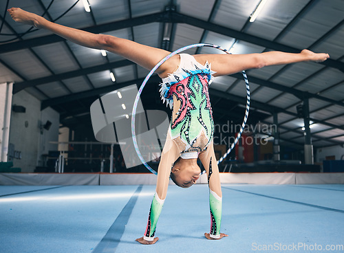 Image of Energy, gymnastics and female with a routine for a performance in a professional arena. Fitness, rhythm and woman athlete or gymnast doing a flexibility and strength trick training for competition.