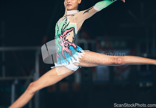 Image of Gymnastics, fitness and zoom on woman jumping in arena for competition, exercise and training with mockup space. Sports, movement and jump, professional gymnast with form and balance in performance.