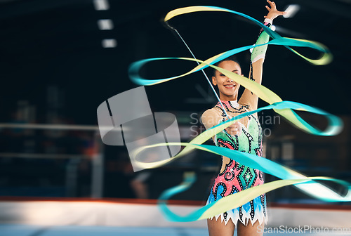 Image of Ribbon dancing, portrait and happy woman in gymnastics competition, talent show and dark mockup arena. Female dancer, rhythmic movement and smile for action, creative performance and sports concert