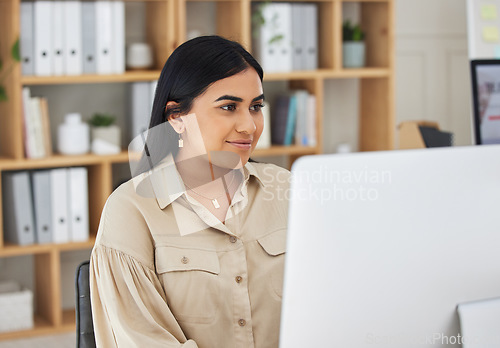 Image of Business, online or Indian woman typing on computer working on email, proposal or project research. Technology, office feedback or girl journalist writing blog reports or internet articles with focus