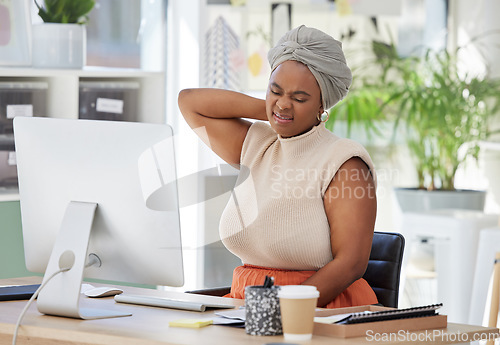 Image of Tired, office or black woman with neck pain injury, burnout or bad ache in a business or company desk table. Posture problems, upset or injured female worker frustrated or stressed by muscle tension