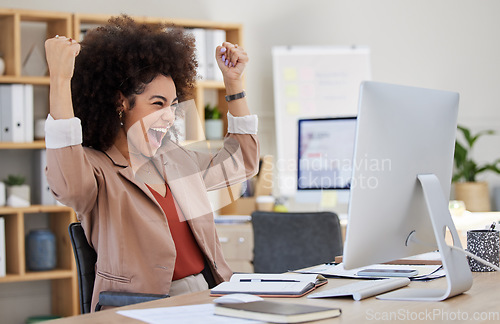 Image of Happy woman winning on computer success, bonus or celebration for news, sales and business cheers in office. Wow, yes and winner or biracial person celebrate, fist pump and reading opportunity on pc