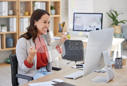 Image of Happy woman winning on computer in success, bonus or celebration for news, sales and business cheers in office. Yes of happy winner or Asian person celebrate, fist pump and reading opportunity on pc