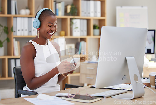 Image of Headphones, mobile or happy black woman in office on social media to relax online on a break. Scroll, podcast or girl journalist texting, typing or searching for chat blogs, news or streaming music