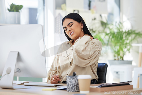 Image of Tired, office or woman with neck pain injury, burnout or bad ache at a business or company desk table. Posture problems, muscle tension or injured female worker frustrated or stressed by emergency