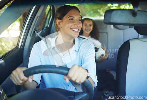 Image of Travel, mother and child in car for drive, fun and sports, soccer and adventure, happy and excited. Mom, driver and girl passenger in vehicle, smile and bonding on road trip to football activity