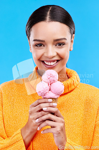 Image of Happy, ice cream and portrait of woman in studio for summer, snack and sweets. Smile, happiness and sugar with female eating frozen gelato on blue background for dessert, junk food and diet mockup