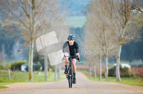 Image of Cycling, fitness and cardio with woman in park for training, workout and health. Exercise, travel and freedom with female cyclist riding on bike in nature for adventure, journey and transport