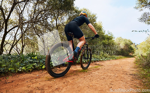 Image of Sports, fitness and cycling with woman on dirt path in nature for workout, training and competition. Strong, cardio and exercise with female cyclist riding on mountain bike for adventure and journey