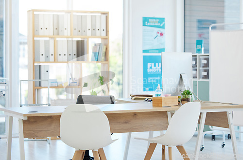 Image of Medical, consulting and hospital with desk in empty room for healthcare, wellness or interior design. Medicine, space and insurance with nobody and furniture in clinic for diagnosis, surgery or virus