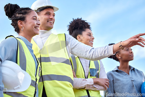 Image of Architecture, construction and happy team in the city, pointing and looking together. Smile, teamwork and group of architects admiring their work in a town, laughing and talking about a site