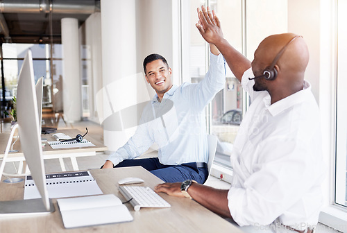 Image of Call center, happy business men and high five of team, success and celebrate winning deal. Diversity, telemarketing and celebration of sales target, excited telecom achievement or bonus trading goals