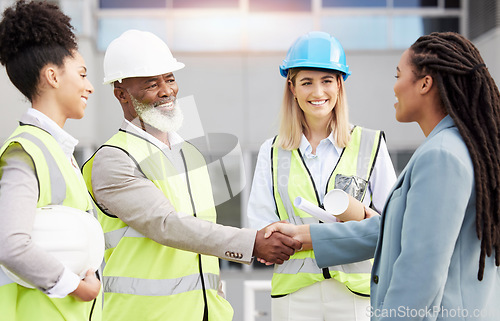 Image of Handshake, architecture and collaboration with people on construction site for planning, engineering and deal. Designer, building and contract with contractors for teamwork, welcome and industry