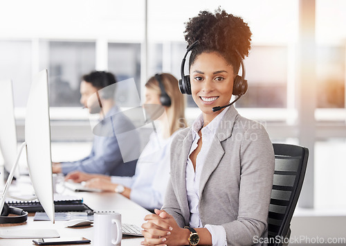 Image of Happy, portrait and woman call center agent working on online consultation in the office. Crm, smile and African female customer service, telemarketing or sales consultant with headset in workplace.