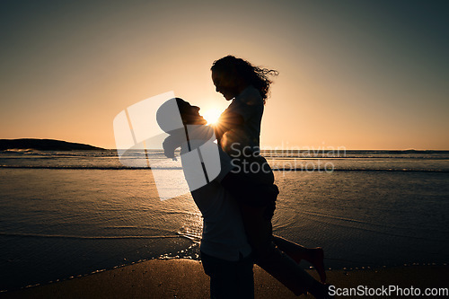 Image of Love, silhouette and sunset with couple at beach for romance, affectionate and summer. Travel, happy and vacation with man and woman hugging for anniversary date, marriage and support on holiday