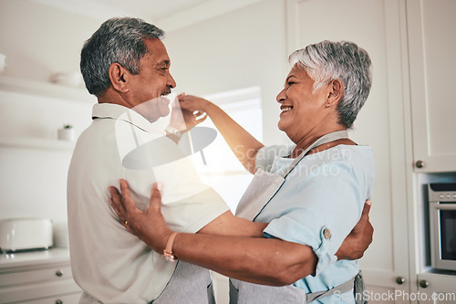 Image of Love, cooking and senior couple dancing in the kitchen together feeling happy, exited and bonding in a home. Care, happiness and romantic old people or lovers dance enjoying retirement in a house