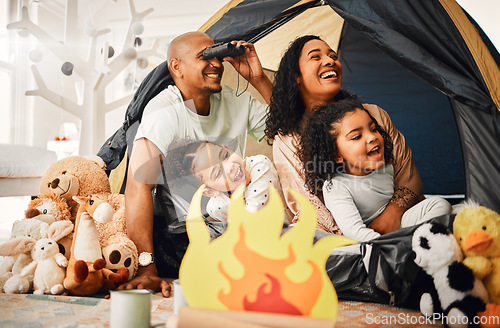 Image of Family, living room and tent with children, games and toys for bonding, love and playing together. Parents, girl kids and laughing with mom, dad or camping game in home with happiness on lounge floor