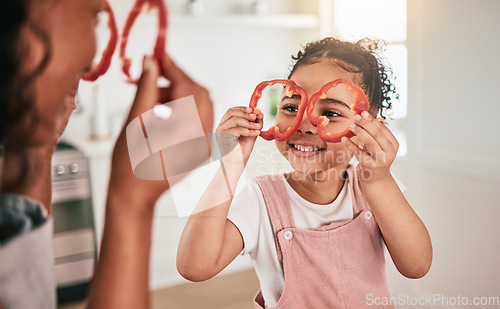 Image of Food, cooking and mother and girl play together for learning, child development and bonding in kitchen. Family home, vegetables and mom and child having fun in meal prep for lunch, dinner and supper