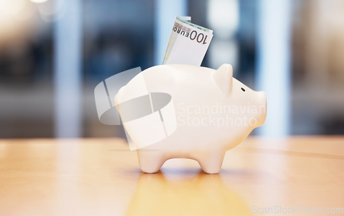 Image of Saving, money and piggybank on a table for finance, budget and investment. Security, dollar and a tool for savings, cash safety and financial growth at a company for banking and pension wealth