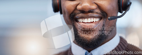 Image of Happy, mouth and closeup of a call center agent with a smile while doing an online consultation. Contact us, mockup and face of an African male customer service representative with headset in office.