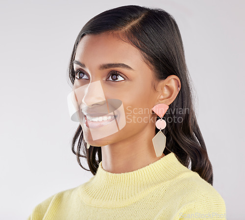 Image of Face, thinking and smile with a woman on a white background in studio closeup to decide on a choice. Head, idea and happy with an attractive young female contemplating a thought about her options