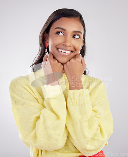 Image of Face, thinking and excited with a woman on a white background in studio closeup to decide on a choice. Head, idea and smile with an attractive young female contemplating a thought about her options