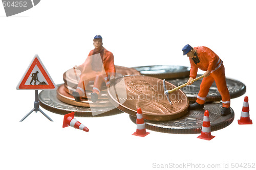 Image of Miniature figures working on a heap of Dollar coins.