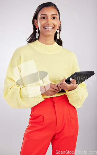 Image of Happy, work and portrait of a woman with a tablet isolated on a white background in a studio. Smile, business and a young girl with technology for social media, email or internet access on a backdrop