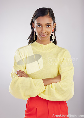 Image of Confident, corporate and portrait of woman arms crossed feeling proud isolated in a studio white background. Confidence, assertive and young Indian female worker, leader or employee with calm mindset