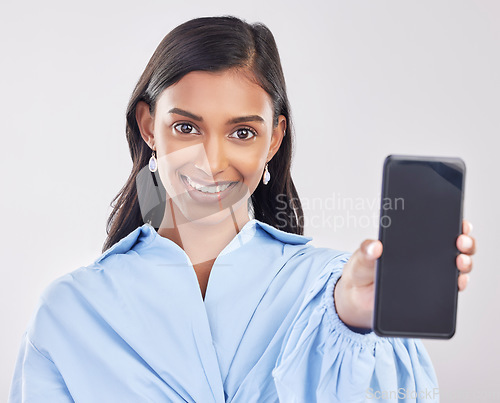 Image of Phone, studio and portrait of Indian woman with smile for advertising, promotion and mockup screen. White background, happy and face of girl with smartphone for social media, website and mobile app