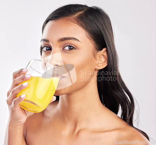 Image of Woman, drinking juice and health with nutrition and portrait, healthy drink and diet on studio background. Weight loss, organic and freshly squeezed beverage with female, wellness and lifestyle