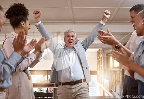 Image of Business people, celebration and winning with applause for promotion, success or teamwork at office. Happy senior businessman in joy for win, victory or achievement with team clapping at workplace