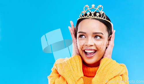 Image of Mockup, crown or happy with woman in studio for celebration, princess and party. Smile, beauty and fashion with female tiara on blue background and excited for achievement, winner and wow prom event