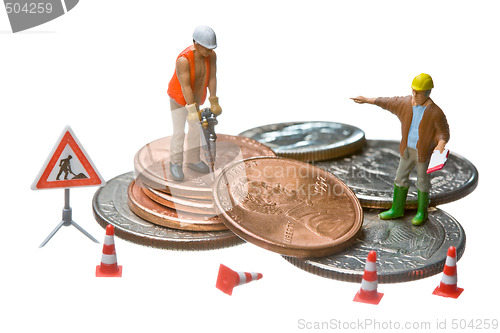 Image of Miniature figures working on a heap of Dollar coins.