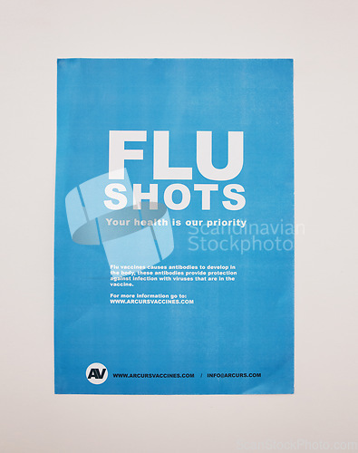 Image of Healthcare background, vaccine and flu shot poster on wall in clinic, hospital and medical pharmacy. Sign, information and advertising vaccination for influenza, immunity and treatment for protection