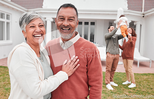 Image of Happy, outdoor and portrait of senior couple standing in the yard of their modern family home. Happiness, smile and elderly man and woman in retirement with their children and grandchild by the house