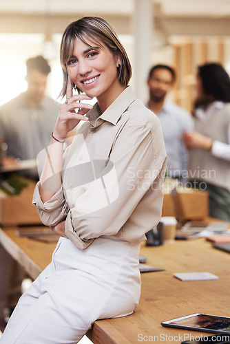 Image of Portrait, meeting and boardroom with a business woman in the office for planning, strategy or management. Training, seminar and smile with a happy female employee sitting on a table during a workshop