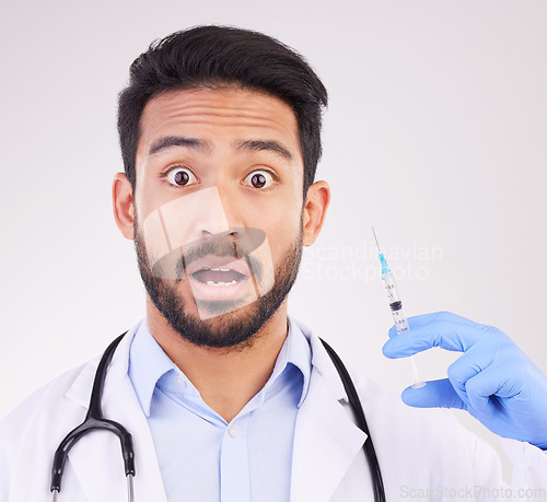 Image of Wow, portrait and doctor with vaccine, syringe and surprise in studio for healthcare innovation on white background. Omg, face and shocked guy health expert with needle for treatment or immunization