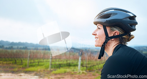 Image of Happy, fitness and woman relax while cycling in the countryside, smile and resting in nature. Cheerful, sports and female cyclist on break in Mexico for travel, vacation or cardio, routine or workout