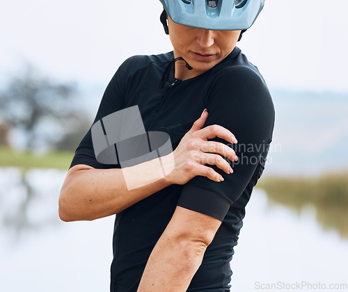 Image of Cycling, injury and woman arm with problem, issue or inflammation after fitness workout in nature. Shoulder pain, girl and cyclist with muscle, joint or bone arthritis, fibromyalgia or osteoporosis