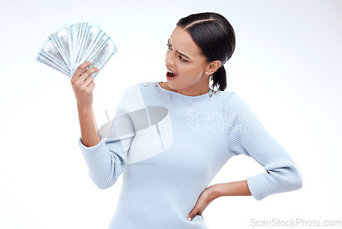 Image of Woman, surprise and cash fan in studio with excited face, shock or winning of prize, bonus or profit. Model, winner girl and isolated person with wow for money, investment or win by white background